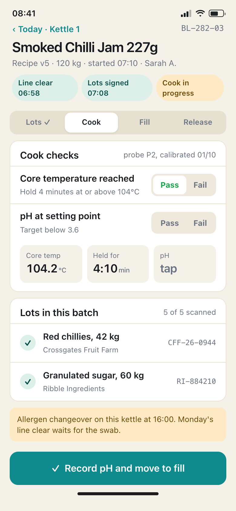 A production batch sheet on a phone, listing the checks recorded against a batch.