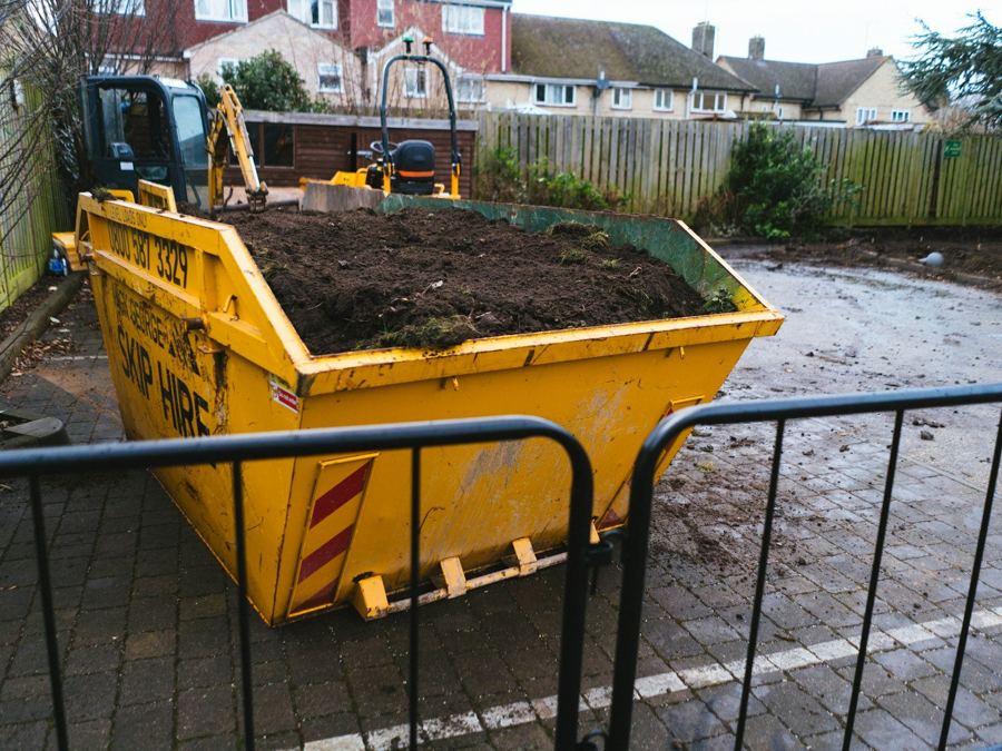 A skip on a residential street.